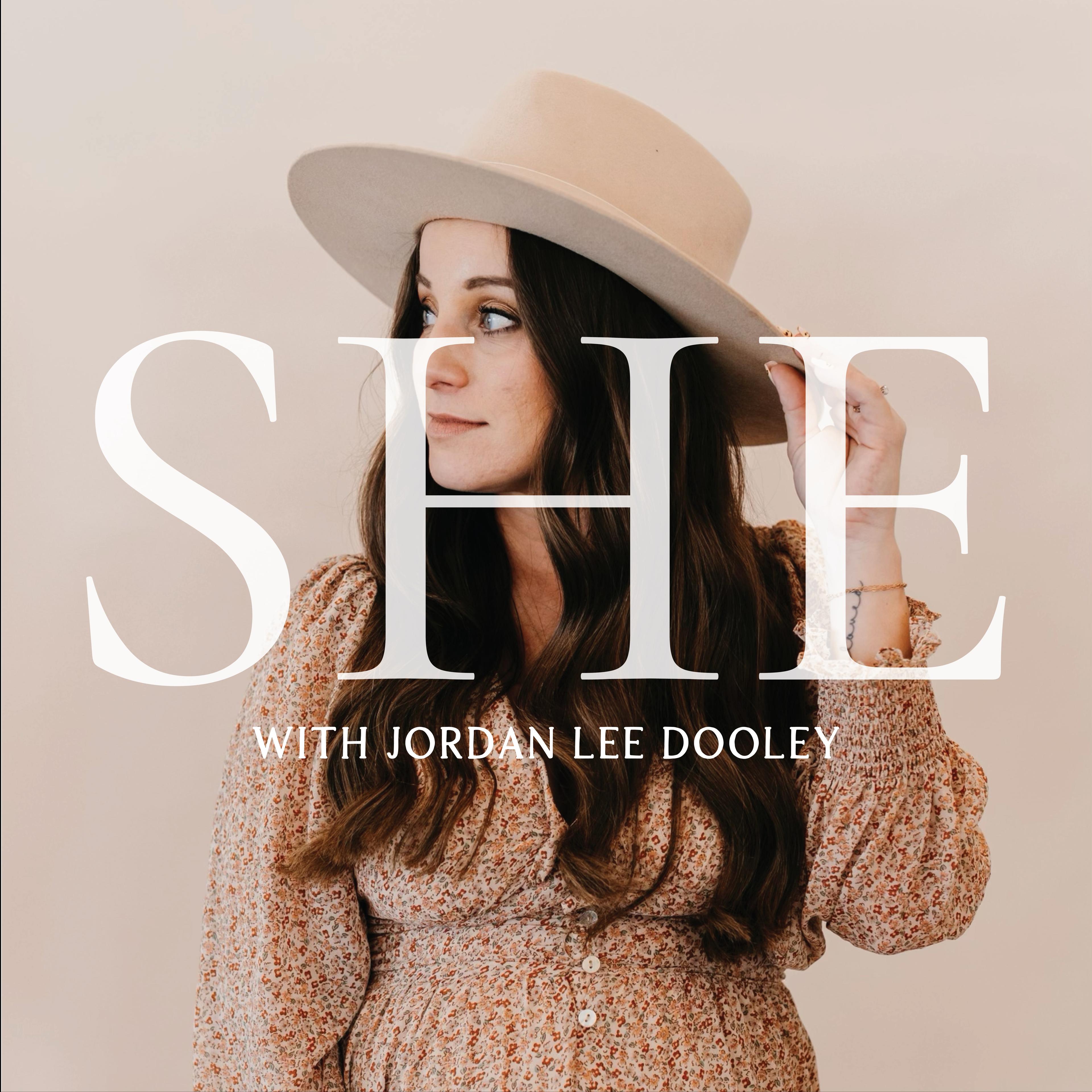 Show poster of SHE  with Jordan Lee Dooley
